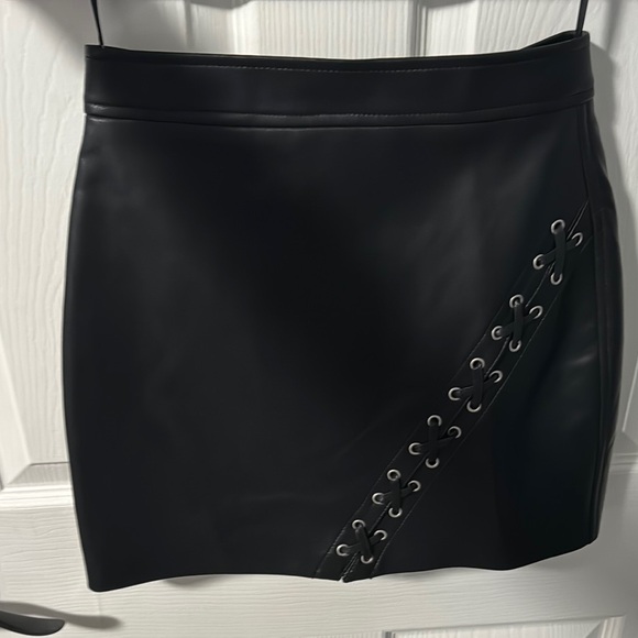 Blank NYC Dresses & Skirts - Black Asymmetrical Cut Out Mini Skirt